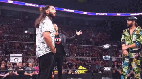 A Wrestling Ring With A Sign That Says We Miss You Kenny On It GIF