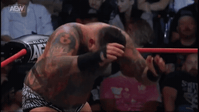 A Wrestling Ring With Aaw Written On The Side GIF