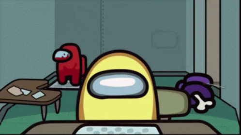 A Yellow Among Us Character Is Sitting At A Table GIF