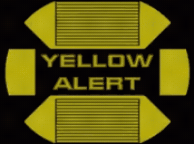 A Yellow And Black Sign That Says Yellow Alert On It GIF