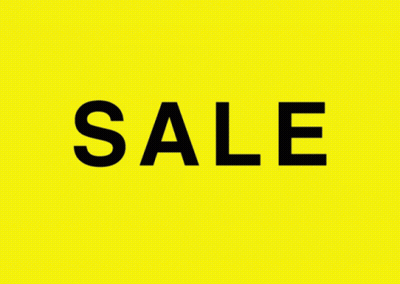 A Yellow Background With The Word Sale Written In Black GIF