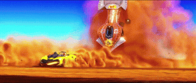 A Yellow Car Is Driving Down A Dirt Road In Front Of A Huge Explosion GIF