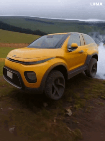 A Yellow Car Is Driving Down A Dirt Road With The Word Luma On The Bottom GIF