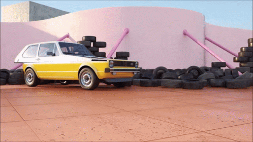 A Yellow Car Is Parked In Front Of A Pink Wall Surrounded By Tires GIF