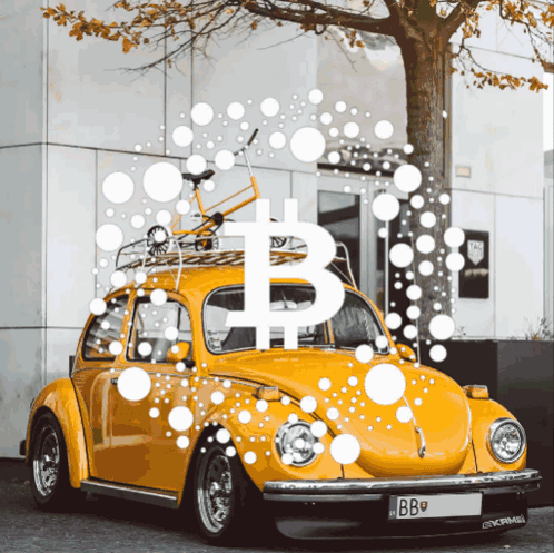 A Yellow Car With A Bicycle On Top Of It And A B On It GIF