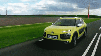 A Yellow Car With A License Plate That Says Dd-929-Vw GIF
