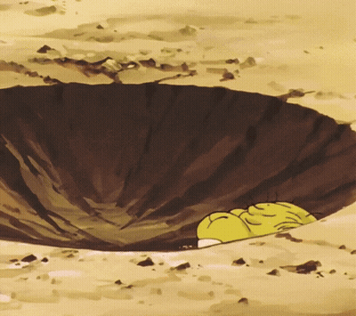 A Yellow Cartoon Character Is Laying In A Hole In The Ground GIF