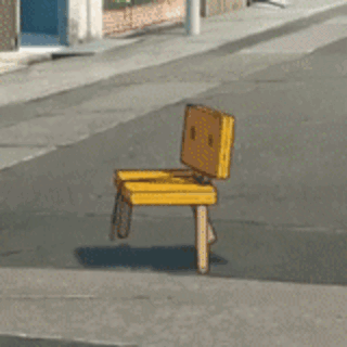 A Yellow Chair Is Sitting On The Sidewalk On The Side Of The Road GIF