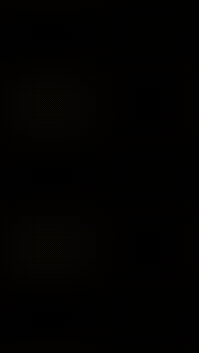 A Yellow Light Is Shining In The Dark With A Black Background GIF