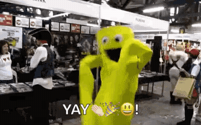 A Yellow Mascot Is Dancing In A Room With People In Costume . GIF