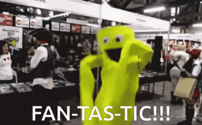 A Yellow Mascot Says Fan-Tas-Tic In Front Of A Crowd Of People GIF