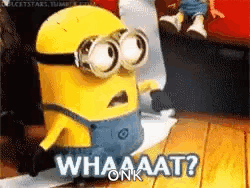 A Yellow Minion Is Sitting On A Wooden Floor And Says `` Whaaat ? '' GIF