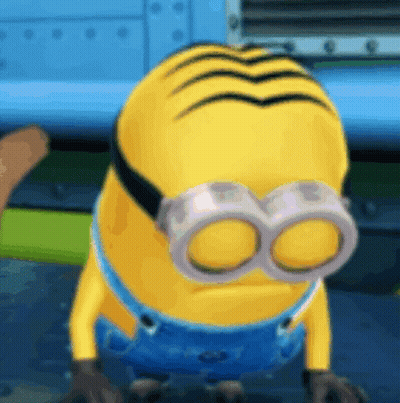 A Yellow Minion Wearing Goggles And Overalls GIF