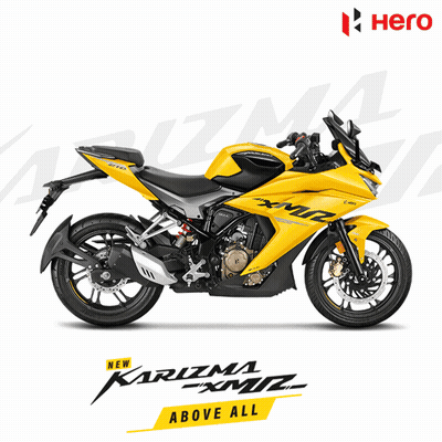 A Yellow Motorcycle With The Words Karizma Above All On It GIF
