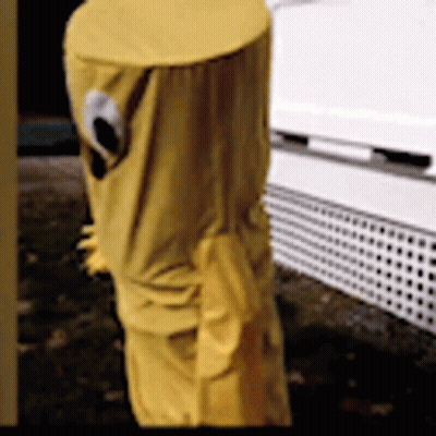 A Yellow Pole With A Hole In It Is Covered In A Yellow Cloth GIF