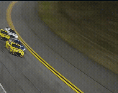 A Yellow Race Car With The Number 22 On The Side GIF