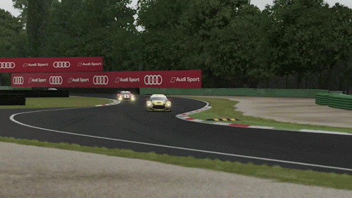 A Yellow Race Car With The Number 35 On The Side Of It GIF