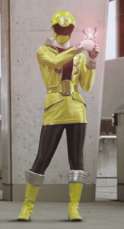 A Yellow Ranger Is Holding A Pink Object GIF
