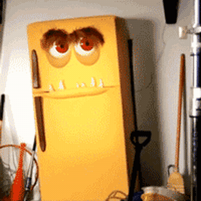 A Yellow Refrigerator With A Cartoon Face Painted On It GIF