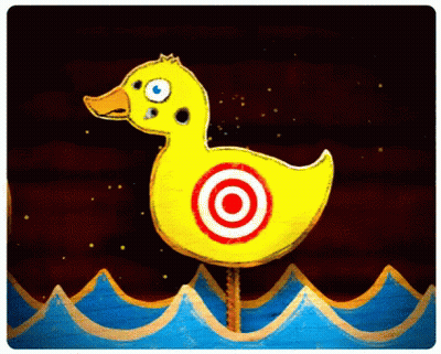 A Yellow Rubber Duck With A Red Target On It GIF