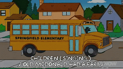 A Yellow School Bus From Springfield Elementary Is Parked On The Side Of The Road GIF
