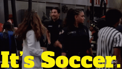 A Yellow Sign That Says It 'S Soccer With A Group Of People GIF