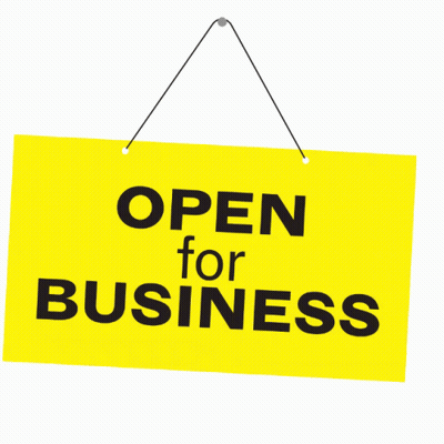 A Yellow Sign That Says Open For Business Hangs On A String GIF