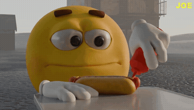 A Yellow Smiley Face Is Eating A Hot Dog With Ketchup On It GIF
