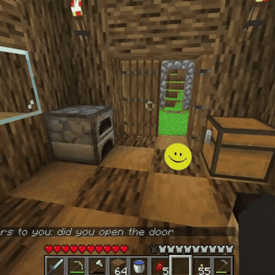 a yellow smiley face is in front of a wooden chest