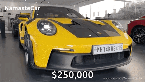 A Yellow Sports Car With A License Plate That Says Mh14kw81415 GIF