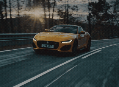 A Yellow Sports Car With The License Plate 374 Ugt GIF