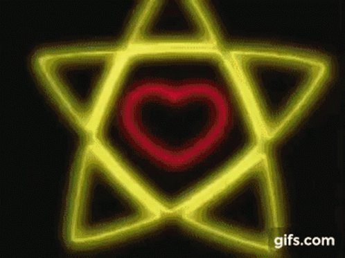 A Yellow Star With A Red Heart In The Middle . GIF