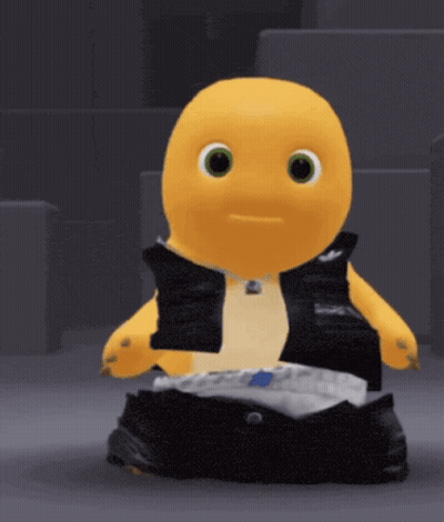 A Yellow Stuffed Animal Is Wearing A Black Vest GIF