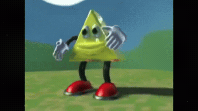 A Yellow Triangle With Arms And Legs Is Standing On A Grassy Field . GIF