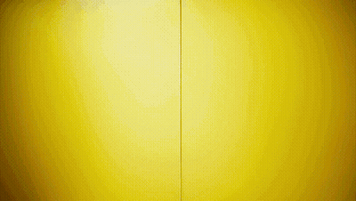 A Yellow Wall With A Red Stripe On The Bottom GIF