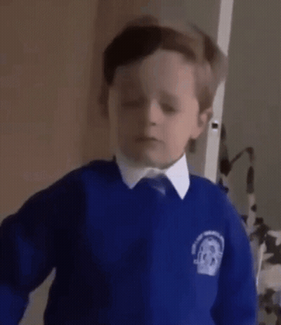 A Young Boy In A Blue School Uniform Is Asking The Question Yes . GIF