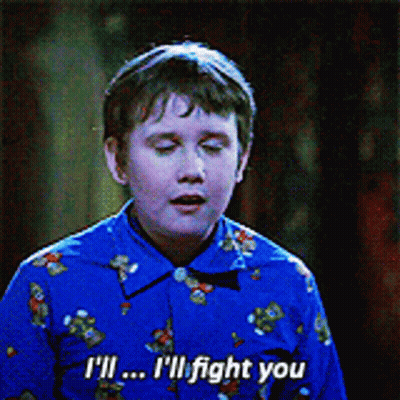 A Young Boy In A Blue Shirt Says " I 'Ll ... I 'Ll Fight You " GIF