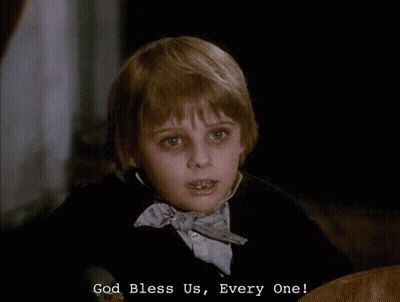 A Young Boy In A Bow Tie Says " God Bless Us " GIF
