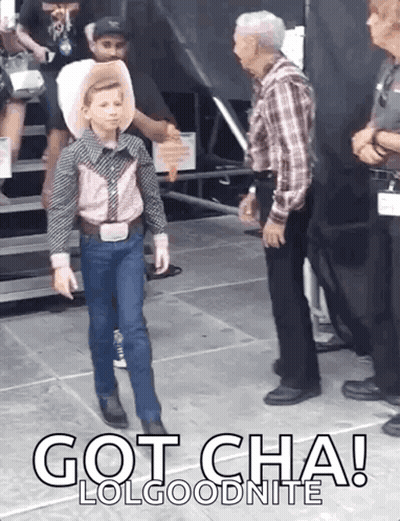 A Young Boy In A Cowboy Outfit Is Standing Next To A Man In A Plaid Shirt With The Words Got Cha Lolgoodnite Below Him GIF