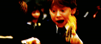 A Young Boy In A Harry Potter Outfit Looks Surprised With His Mouth Open GIF