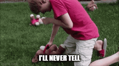 A Young Boy In A Pink Shirt Is Kneeling Down In The Grass With A Stuffed Animal . GIF