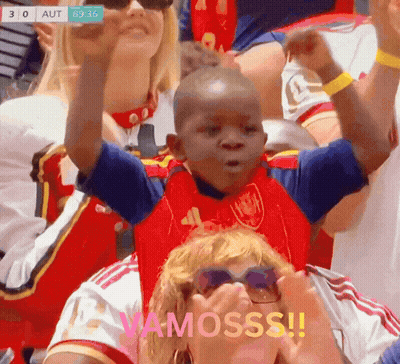 A Young Boy In A Red And Blue Shirt With The Word Vamosss On The Bottom GIF