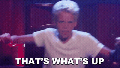 A Young Boy In A White Shirt Is Dancing With The Words That 'S What 'S Up . GIF