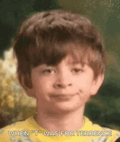 A Young Boy In A Yellow Shirt Is Smiling With The Words `` When T Was For Terrence '' Written Below Him . GIF