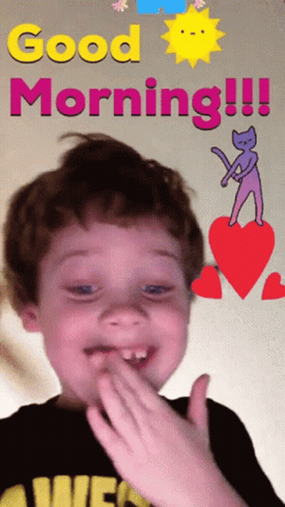 A Young Boy Is Covering His Mouth In Front Of A Sign That Says " Good Morning " GIF