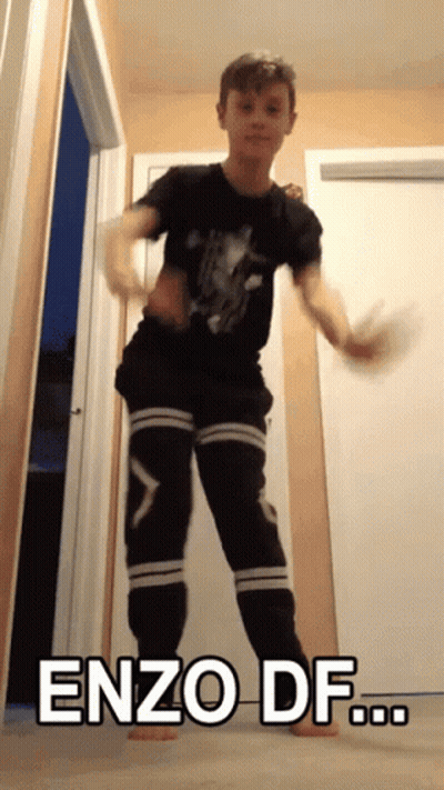 A Young Boy Is Dancing With The Words Enzo Df Written On The Bottom GIF