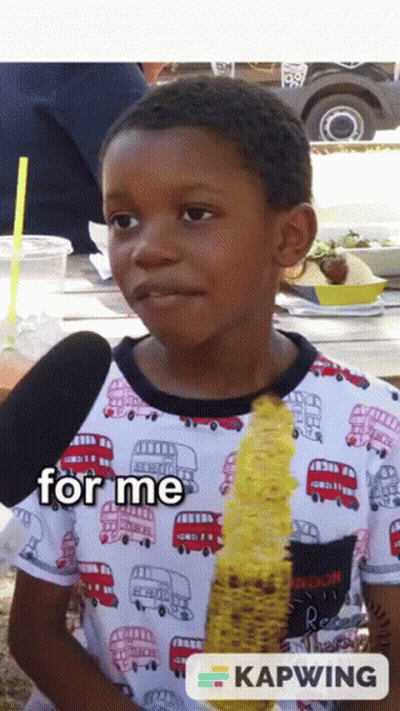 A Young Boy Is Eating Corn On The Cob And The Words For Me Are On The Bottom GIF