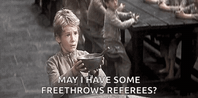 A Young Boy Is Holding A Bowl Of Soup In Front Of A Table . GIF