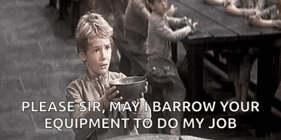 A Young Boy Is Holding A Bowl Of Soup In Front Of A Table . GIF