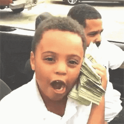 A Young Boy Is Holding A Stack Of Money In His Hand And Making A Funny Face . GIF